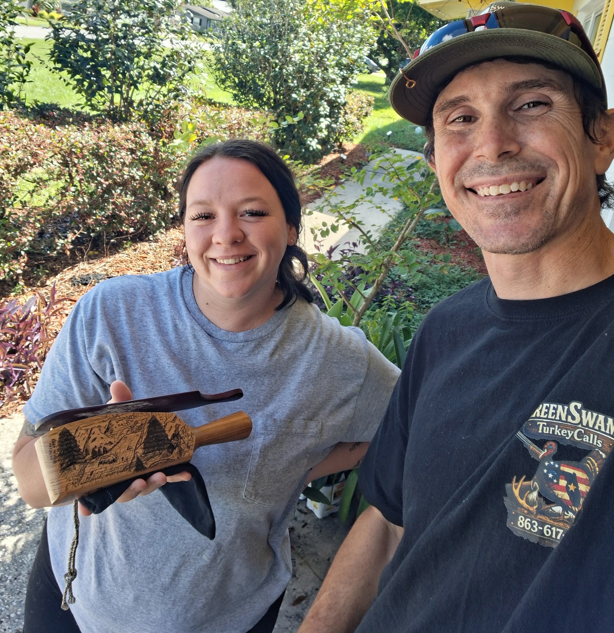 A Green Swamp Turkey Calls customer holding a custom hand-burned box call